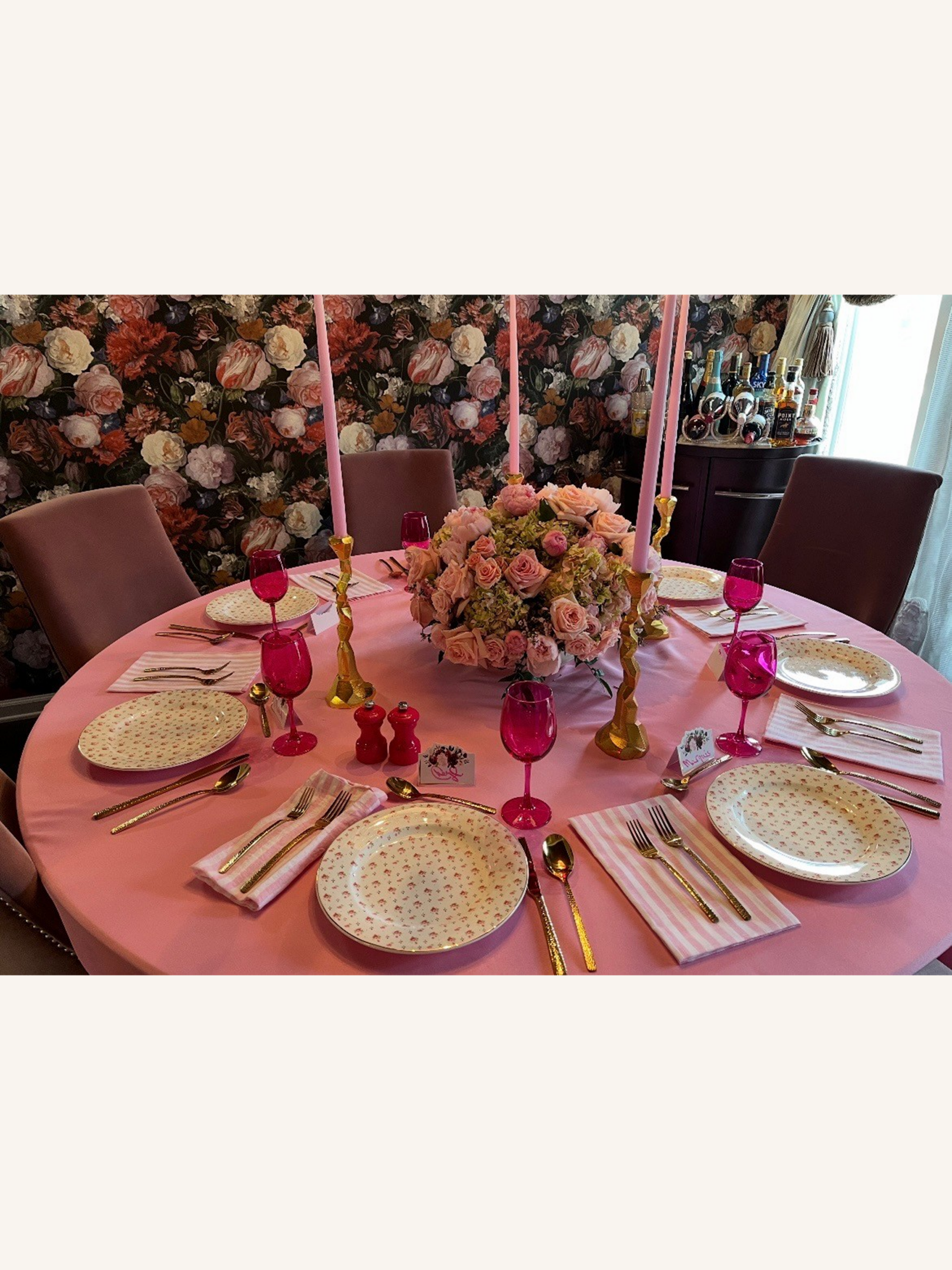 Elegant table setting with pink accents.