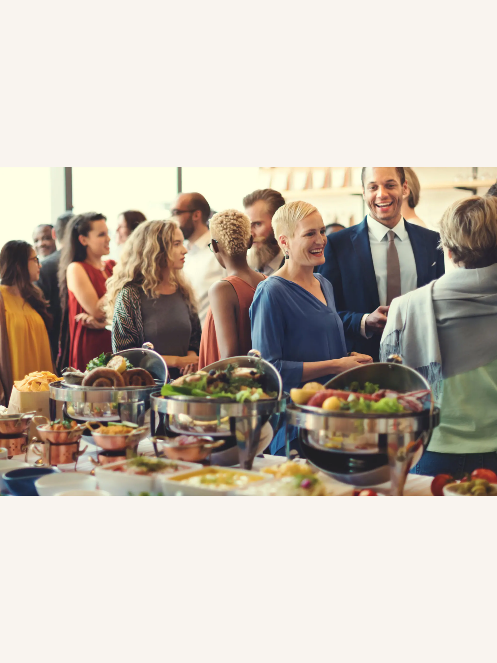 People socializing at a buffet event.